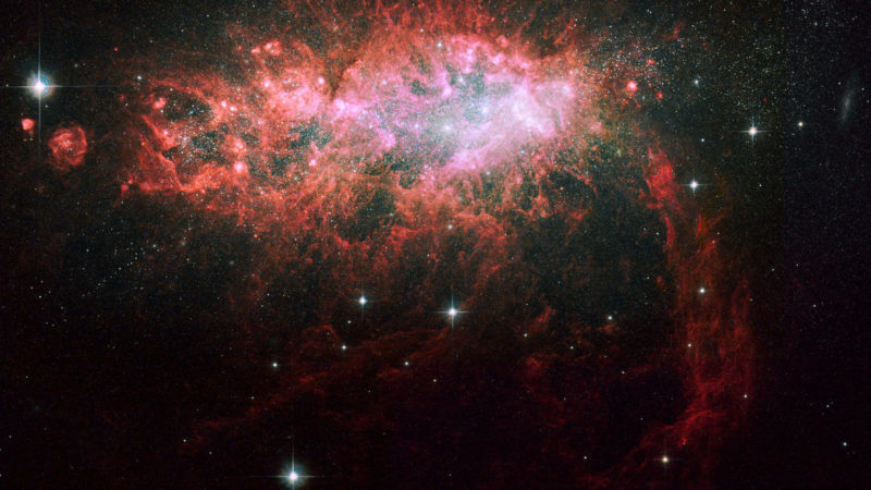 NGC 1569: A nearby galaxy bursting with star birth – SYFY WIRE