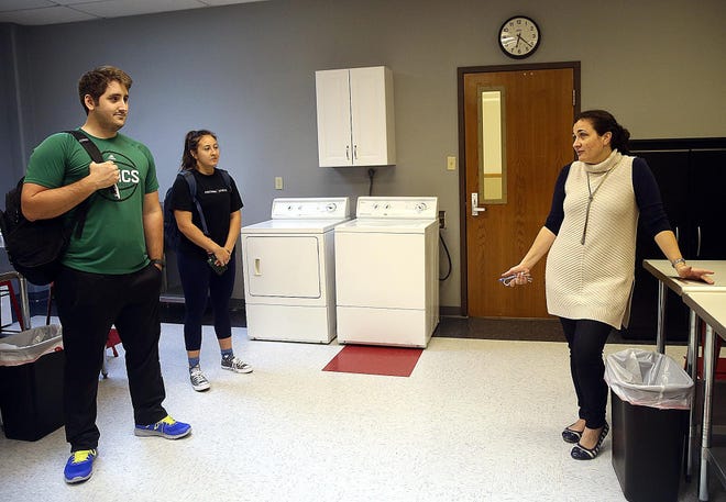 Bridget Scott, associate dean of Nicholls' College of Sciences and Technology, discusses the newly renovated dietetics lab in 2017 with seniors Conner Harris, of Gonzales, and Jacey Busbice, of Morgan City.