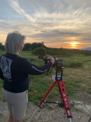 Terri Zittritsch of Williston reviews some of her eclipse photos on her camera's view screen. She had some of the most advanced equipment for solar picture taking among the Vermont Astronomical Society members gathered for the annular eclipse in South Burlington on June 10, 2021.